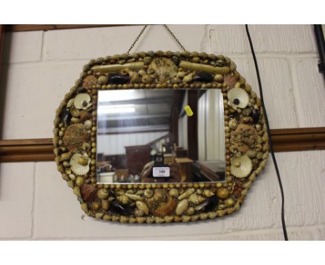 A sea shell framed wall mirror