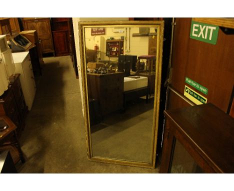 A large gilt framed wall mirror