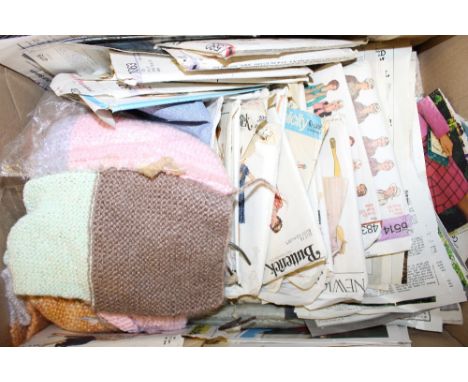 A box of vintage knitting and sewing patterns