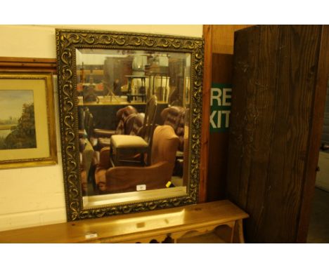A gilt framed and bevel edged wall mirror