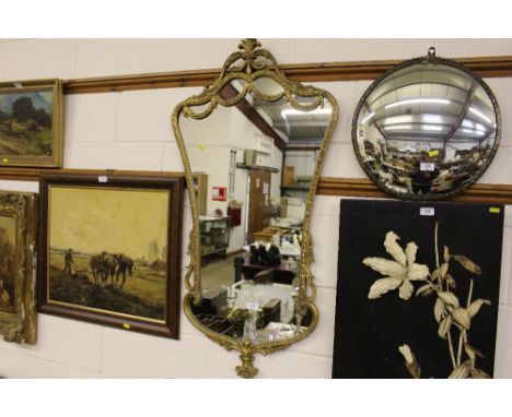 An ornate gilt framed wall mirror
