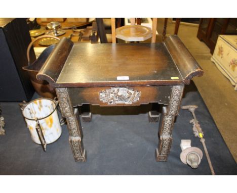A Chinese hardwood stool carved in relief depicting figures in a garden setting