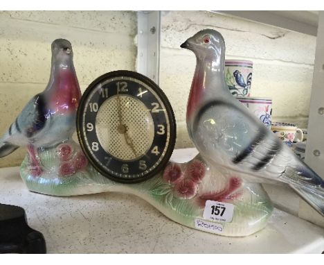 A Continental china mantle clock modelled as a pair of birds.