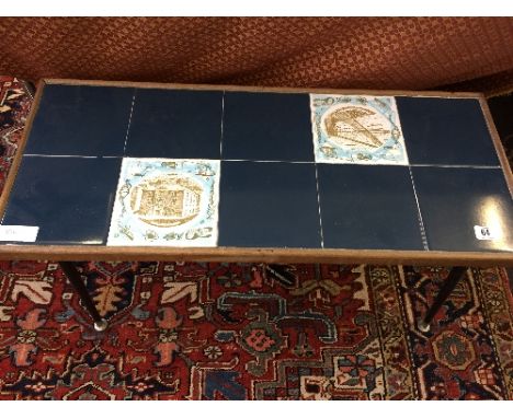A mid 20th century Poole Pottery tile top coffee table, inset ten tiles including Fisherman's Quay and Customs House.