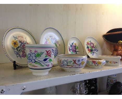 Four various Poole Pottery white bodied Traditional plates together with a footed pot decorated in the BN pattern and three o