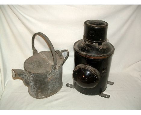 A large oil lamp container with Red lens and fixing plates to container bottom and a water or sand Can embossed GR with Crown