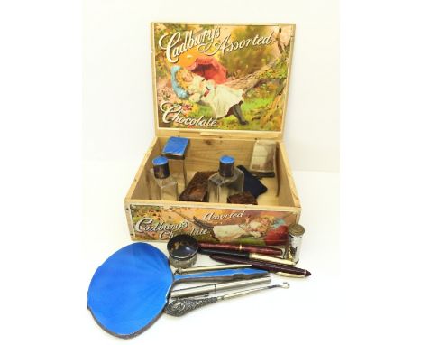 A Cadbury wooden chocolate box containing the residue of a silver plated and blue enamel vanity set, silver and tortoiseshell