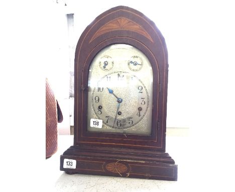 An early 20th century inlaid mahogany bracket clock with chiming movement (16.5 inches).