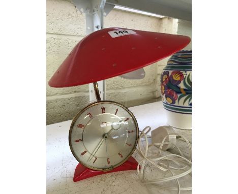 A mid 20th century Metamec desk lamp/clock with combined light fitting.