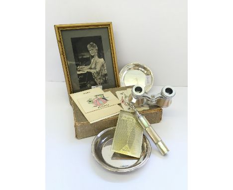 A mother of pearl cased pair of opera glasses together with an Art Deco engine turned silver plated notebook holder and other