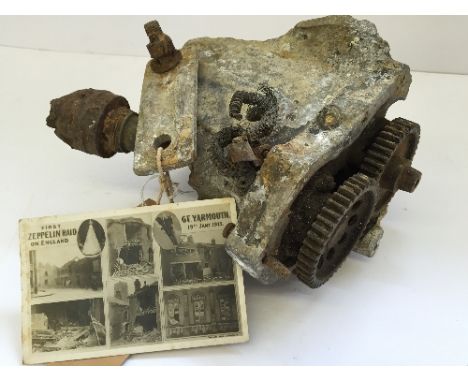 WWI L/3 Zeppelin fragment: part of engine block for drive shaft and propellor propulsion, with tag stamped 'Whitehall Theatre