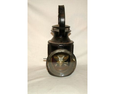 A Railway Lantern with single clear lens and original porcelain wick holder in Good condition.