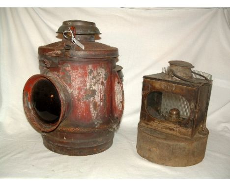 A large Red Lamp holder with 2 x Red Lens containing an oil lamp  marked SR with 2 clear lens.