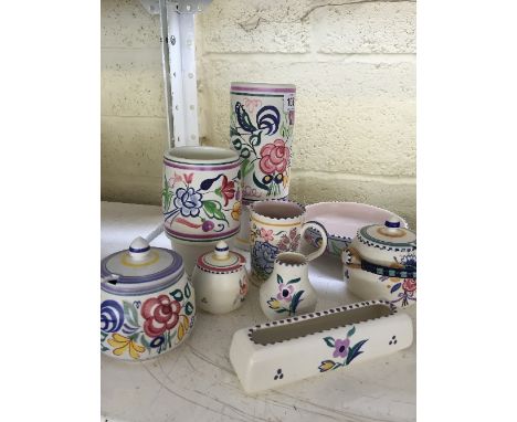 A collection of various white bodied traditional Poole Pottery items.