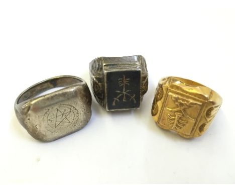 A silver gent's Jewish dress ring together with another silver ring and a gold plated ring.