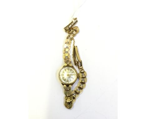 A ladies' 9 carat gold Rotary wristwatch on 9 carat gold strap (13.4 grams overall).