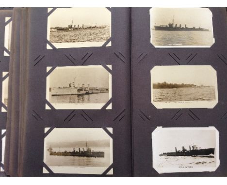 A large early 20th century postcard album containing an original collection from the period, of over 500 black and white post