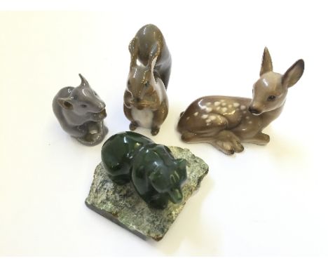 Three Continental miniature china animal ornaments together with a green jade style miniature model of a Bear on stone base.