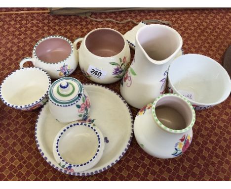 A collection of various white bodied Traditional Poole Pottery items.