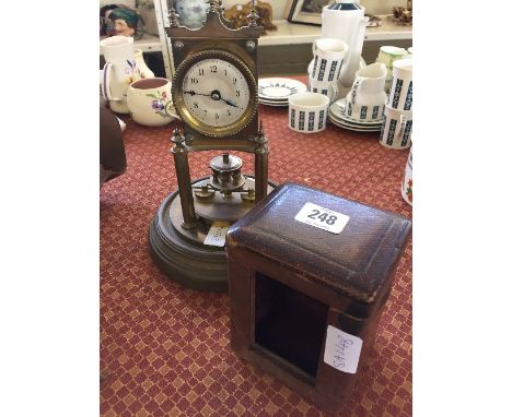A late 19th century French brass Anniversary clock, manufactured by Gustav Becker together with a leather carriage clock case