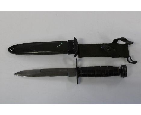 A WW2 period US M8 bayonet/combat knife for M1 carbine with correct scabbard (slight damage to handle) 