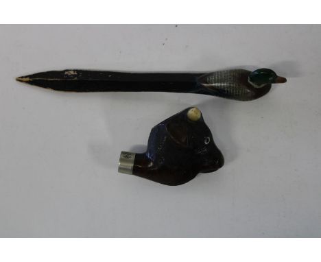 A 19th century pipe head carved from horn &amp; wood ad a hand carved novelty page turner 