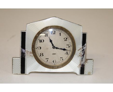 A hallmarked silver Art Deco period alarm clock with enamel decoration (damage to enamel work) 