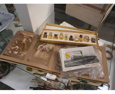 tray of vintage postcards,photos and perfume