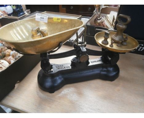 set of libra scales with pans and weights