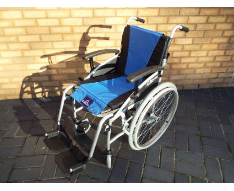 An Excel G-Lite Pro wheelchair with 16inch wheels, instruction manual and original sales receipt from January 2018 - This lot