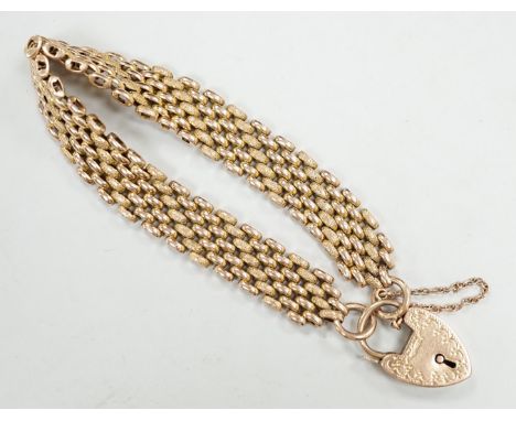 An early 20th century yellow metal (stamped 9c) gate link bracelet, with heart shaped padlock clasp, 18cm, 24.7 grams.