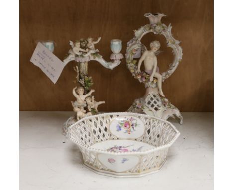 A Volkstedt porcelain candelabrum decorated with cherubs, a candlestick and an octagonal basket