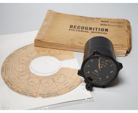 A WWII Air Ministry altimeter model XIV B and a War &amp; Navy Department aircraft recognition pictorial manual