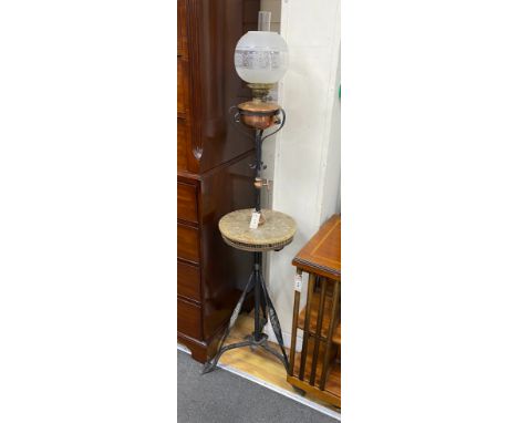 An Edwardian wrought iron and copper telescopic standard lamp with alabaster tier