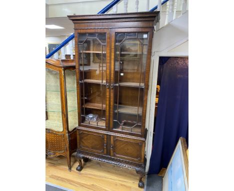 A 1920's Chippendale Revival mahogany bookcase, width 100cm, depth 30cm, height 220cm
