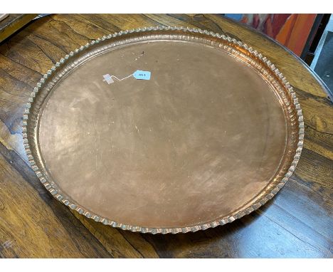 A large circular copper tray, diameter 74cm
