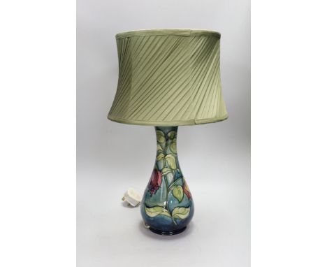 A 20th century Moorcroft lamp, stamped and with a Moorcroft label on the base, 35cms high (not including light fitting)