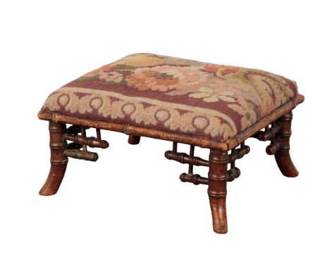A VICTORIAN GILTWOOD RECTANGULAR FOOTSTOOL 19th Century, with bamboo style legs, the top upholstery in floral tapestry, 17cm 