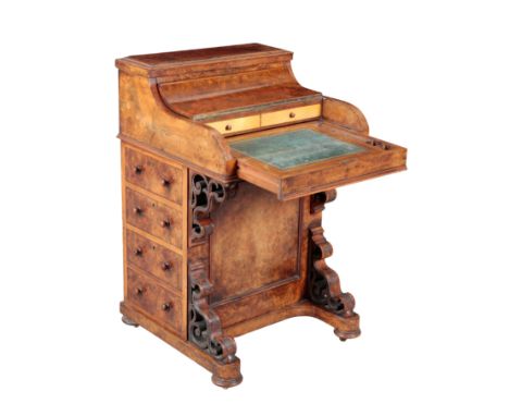 A VICTORIAN BURR WALNUT PIANO TOP DAVENPORT Circa 1880, with a fitted interior and sliding leather and gilt tooled writing su