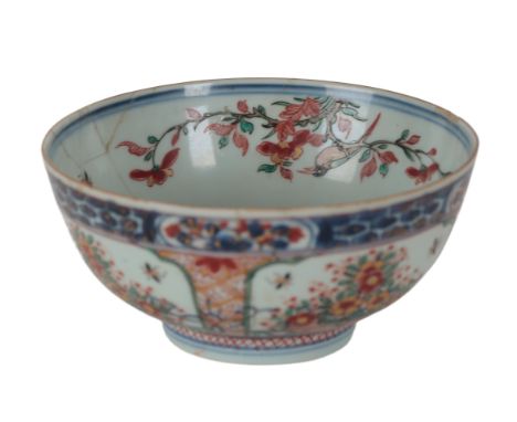 A CHINESE CLOBBERED BOWL Kangxi period, later decorated, probably in Holland, the body decorated with baskets of flowers in b