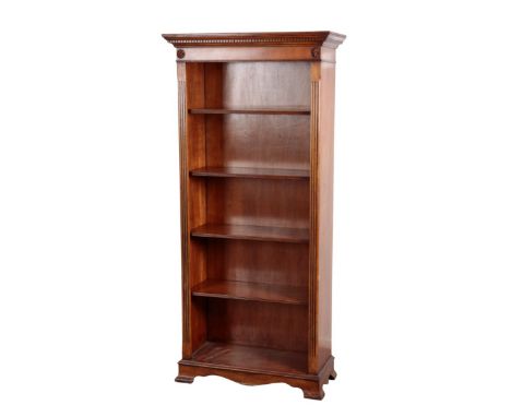 A MAHOGANY AND FRUITWOOD FINISH OPEN FRONT BOOKCASE 20th Century in the Georgian style, with dentil moulded cornice, reeded u