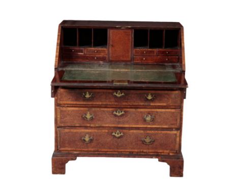 A GEORGE III WALNUT, CROSS BANDED AND BRASS STRUNG BUREAU 18th century, the fall front opening to a fitted interior, with ins