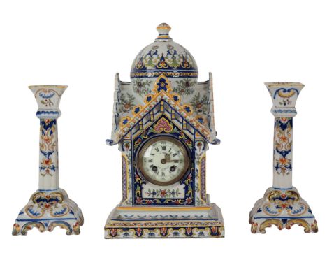 A FRENCH FAIENCE MANTEL CLOCK the 7 cm dial inscribed " Au Negre 19 BD St Denis 19 Paris", the base with "Rouen" marking, 38c
