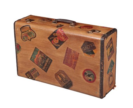 A VINTAGE SUITCASE with brown leather trimmed borders, 65cm x 40cm x 20cm, later decorated with reproduction labels EGFrom th
