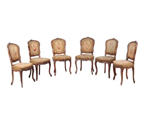 A SET OF SIX LOUIS XV STYLE BEECH WOOD DINING CHAIRS 19th century, each with floral tapestry upholstered seat and back, on sl