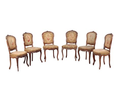 A SET OF SIX LOUIS XV STYLE BEECH WOOD DINING CHAIRS 19th century, each with floral tapestry upholstered seat and back, on sl