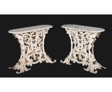 A PAIR OF WHITE-PAINTED CAST IRON CONSOLE TABLES late 19th century with later oval grey veined marble tops, on splayed leaf s