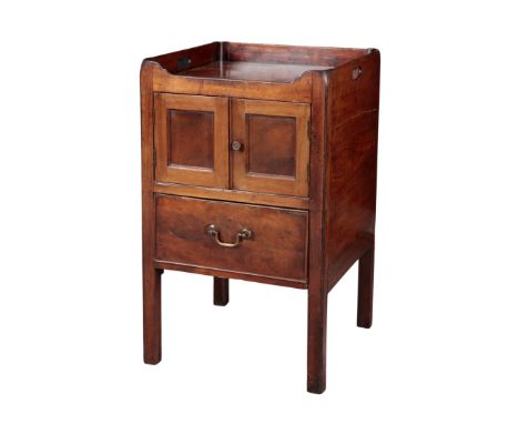 A MAHOGANY TRAYTOP COMMODE OF GEORGIAN STYLE 20th Century, the top with handle cut-outs, pair of panelled doors and single dr