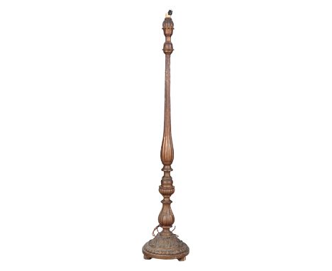 A CARVED GILTWOOD AND COMPOSITION STANDARD LAMP 20th century, with a reeded column on a turned and carved base, 154cm highPro