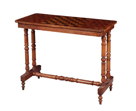 A VICTORIAN WALNUT GAMES TABLE 19th Century, the rectangular top inset with chessboard and parquetry inlay, on twin turned en